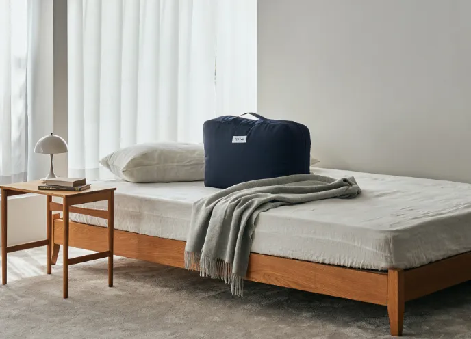 ケースにコンパクトに収まるBakune 掛け布団のイメージ写真。